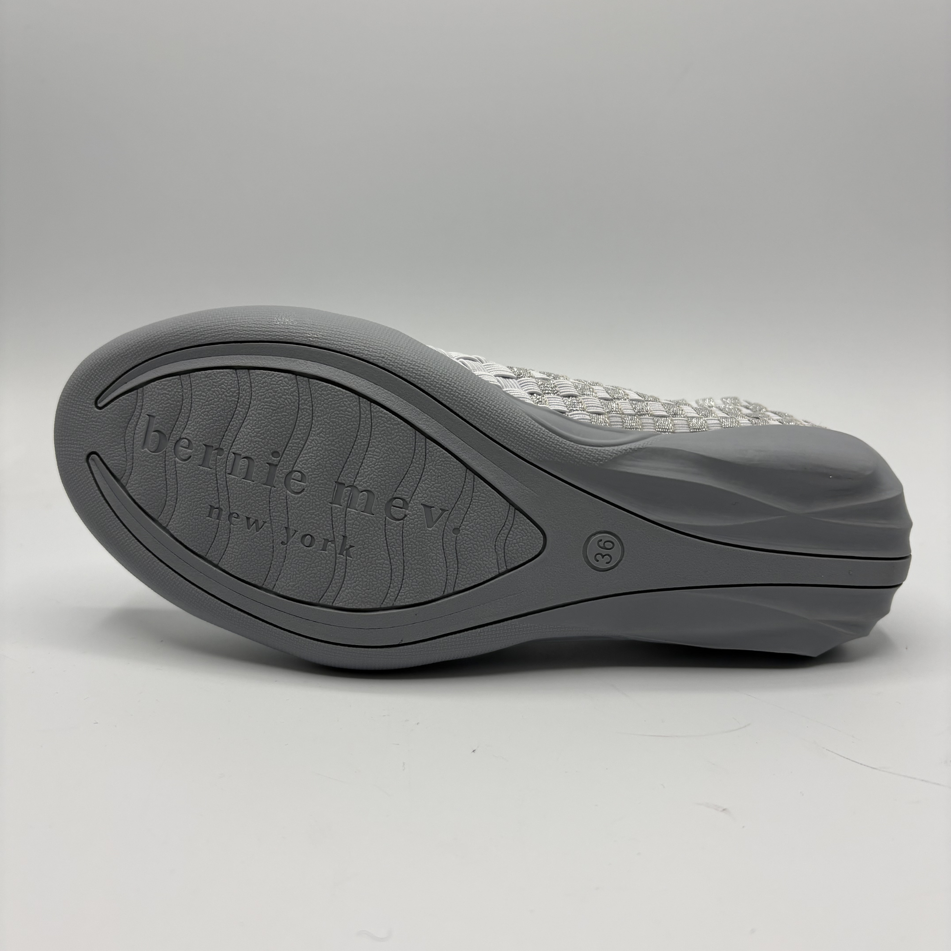 Gray shoe sole with 'Bernie Mev' branding on a white background