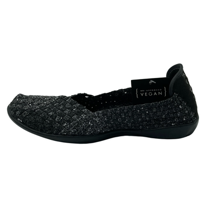 Left facing view of black and grey flat shoe with black outsole