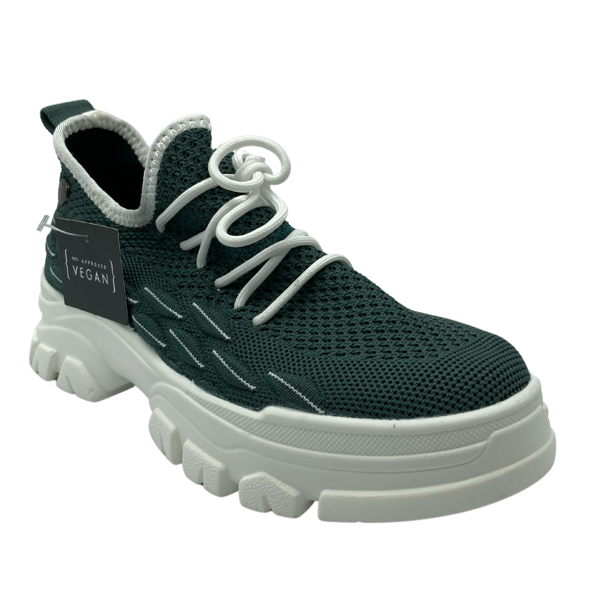 45 degree angled view of pine green mesh sneaker with white rubber platform sole