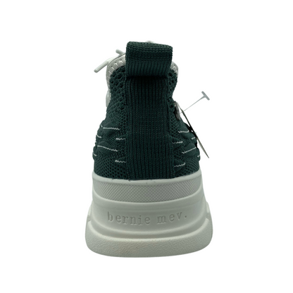 Back view of green mesh sneaker with white rubber platform sole