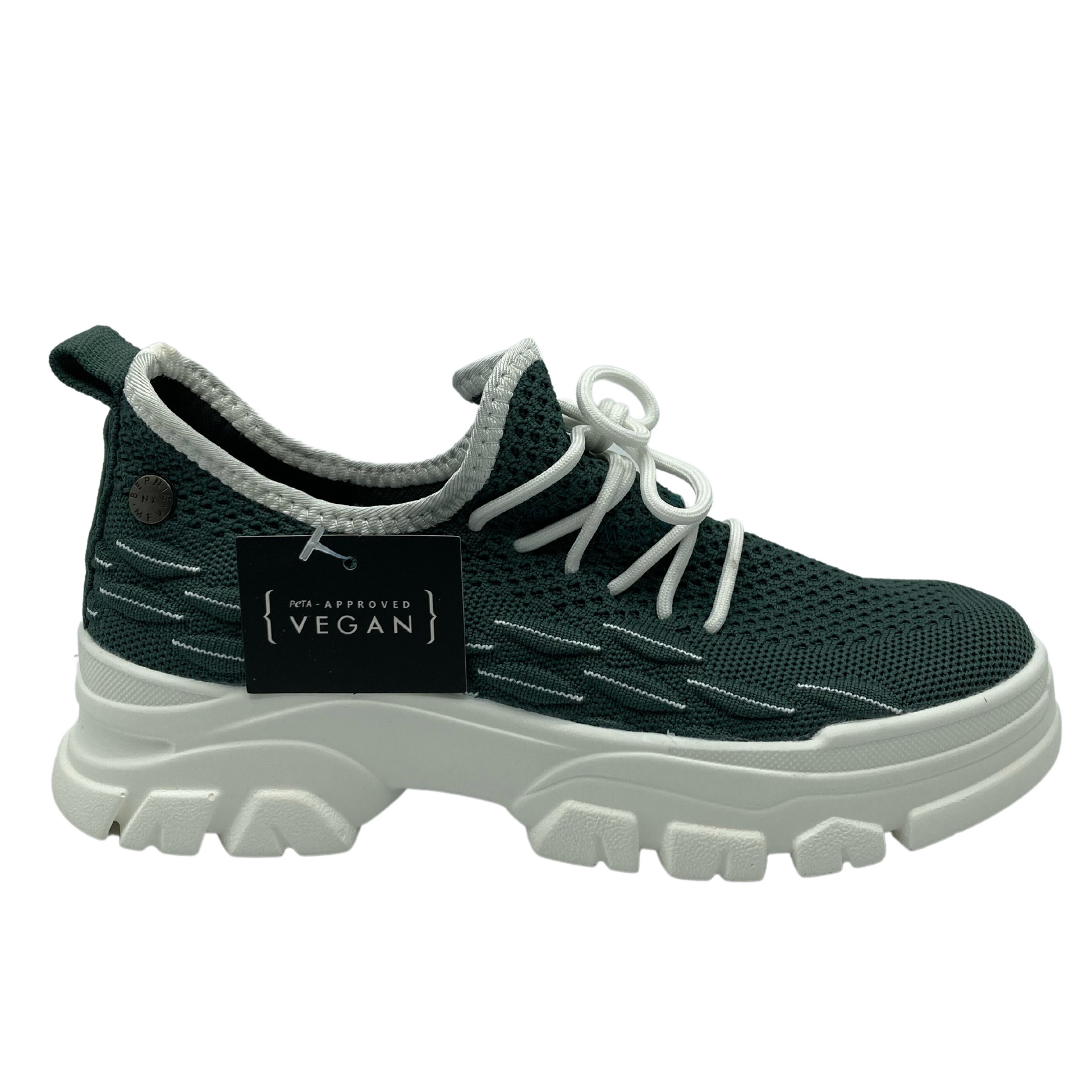 Right facing view of green mesh sneaker with white rubber platform sole and white laces