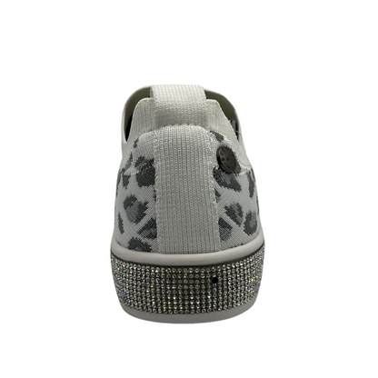 Back view of a slip on style sneaker in a fun leopard print with silver crystal accents. Shown in white