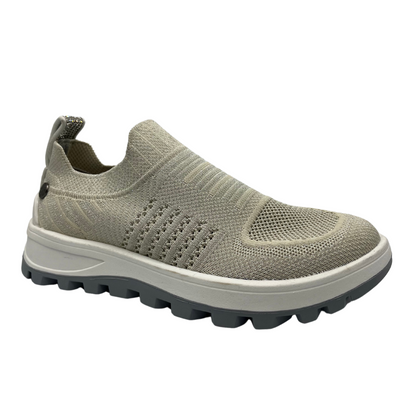 45 degree angled view of knit upper sneaker with pull on heel tab and lightweight rubber outsole