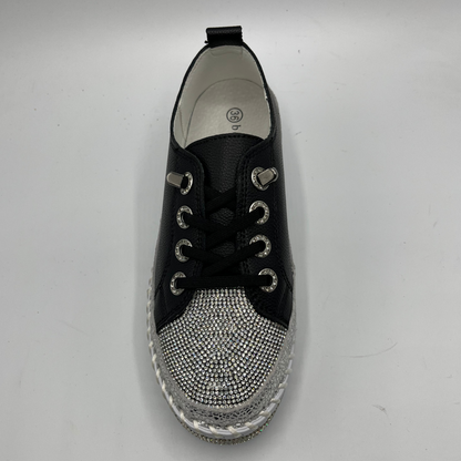 Black sneaker with rhinestone embellishments on a white background