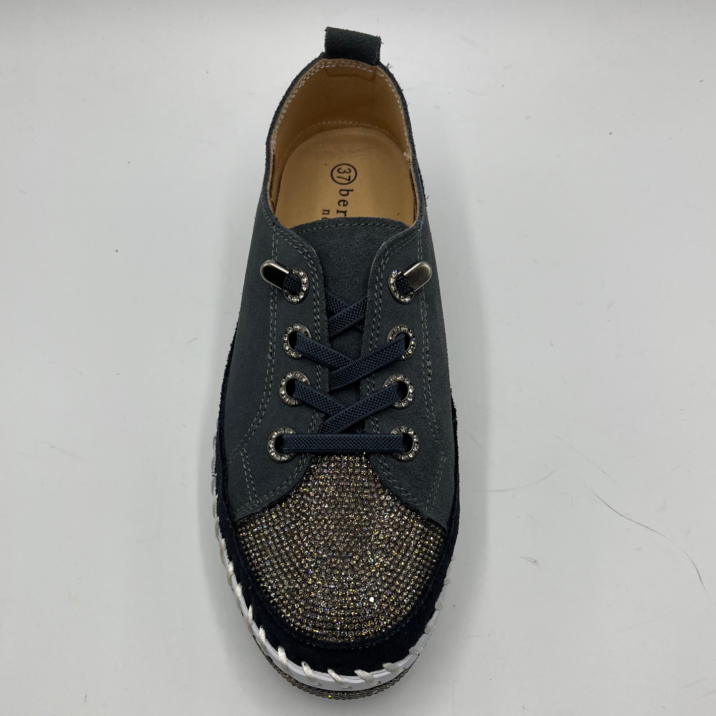 Dark grey sneaker sneaker with rhinestone embellishments on a white background