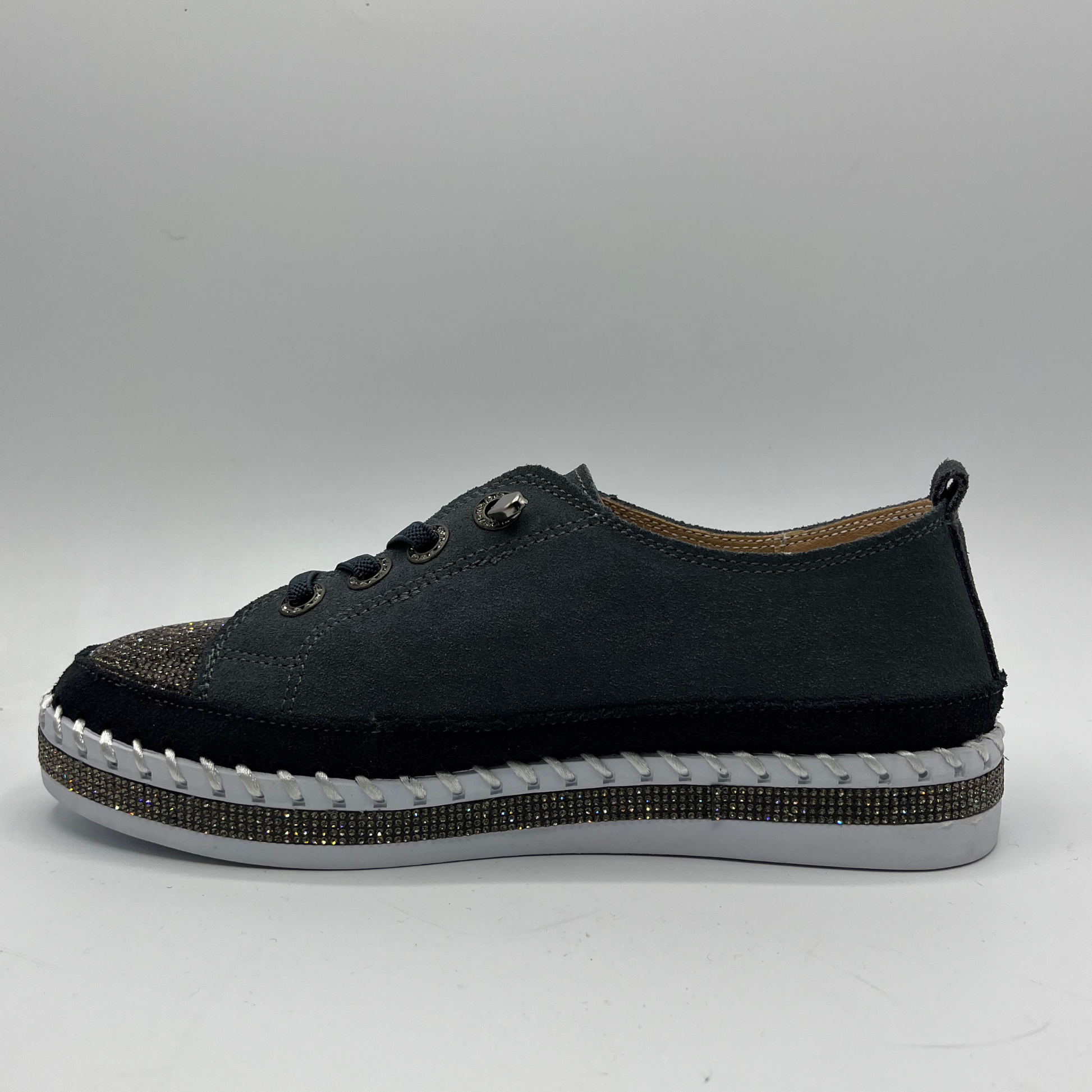 Dark Grey sneaker with white sole on a gray background