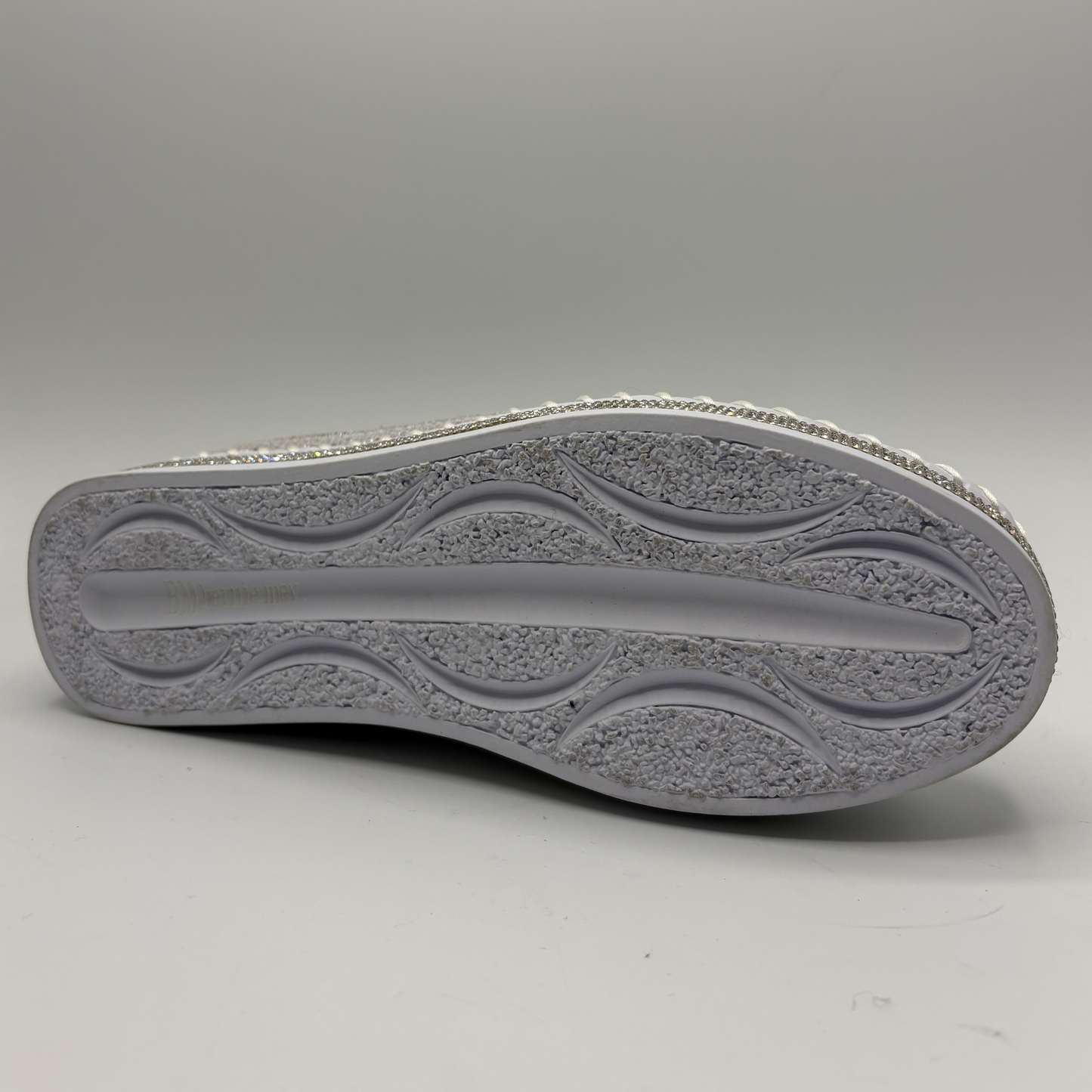 Close-up of a gray shoe sole on a light gray background
