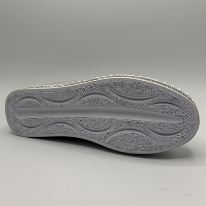 Close-up of a gray shoe sole on a light gray background