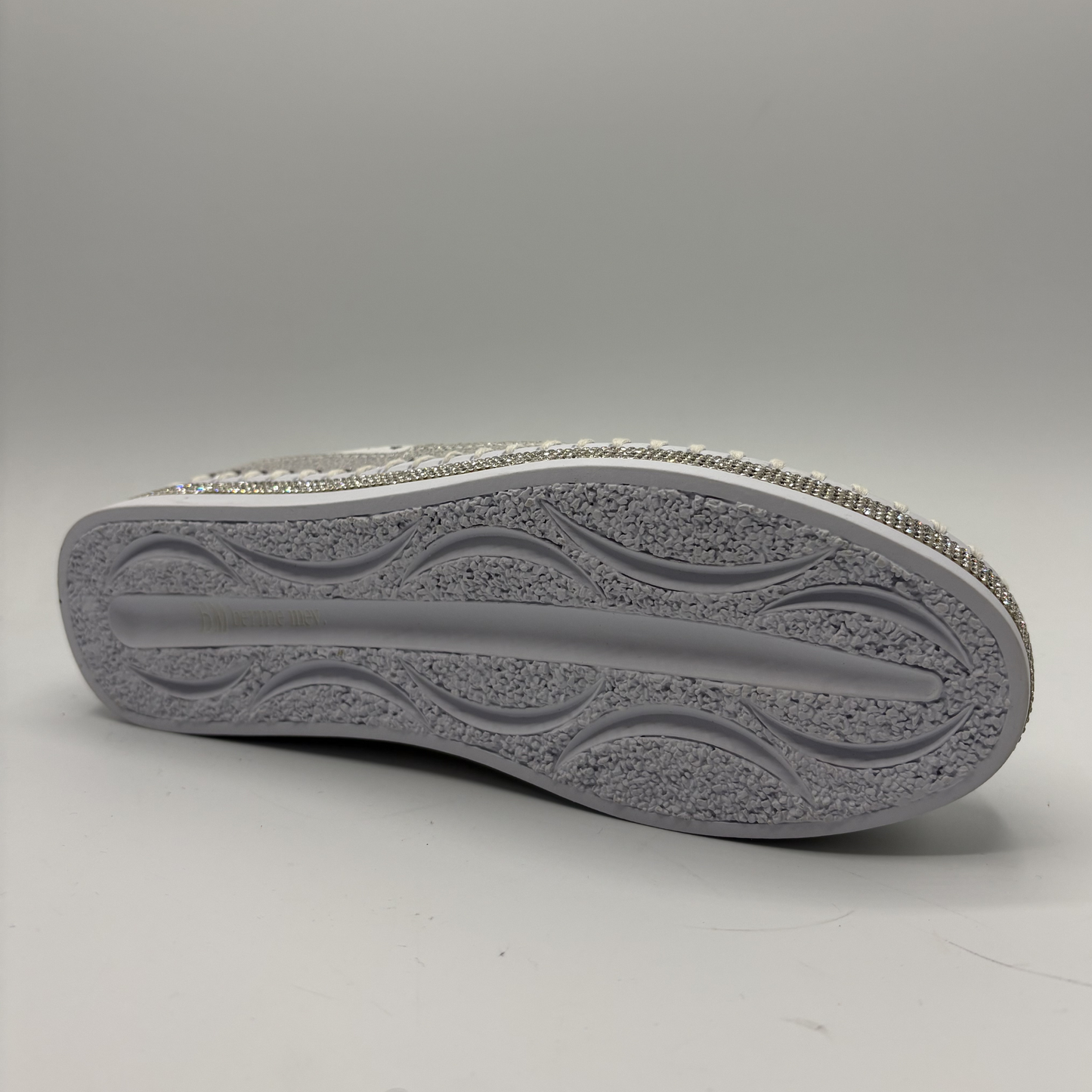 Gray shoe sole on a light gray background
