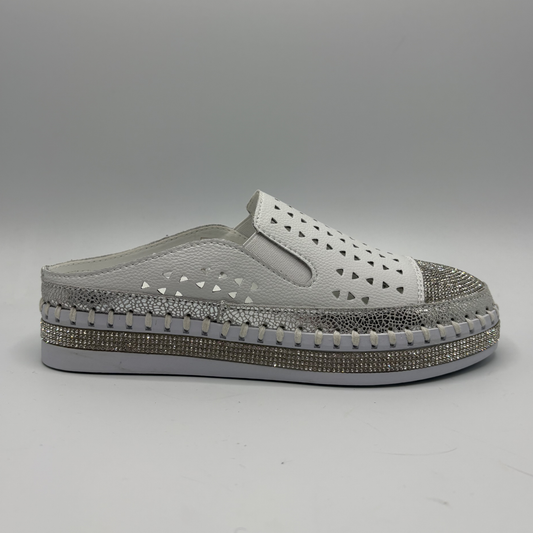 Gray slip-on shoe with decorative sole on a gray background