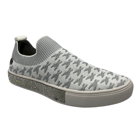 45 degree angled view of knit slip on shoe with white rubber outsole and crystal bling detail around outsole