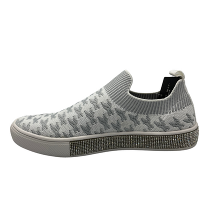 Left facing view of knit slip on shoe with white rubber outsole and crystal bling detail around outsole