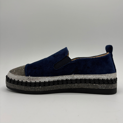 Left facing view of a navy sneaker with rhinestone embellishments and a platform outsole.