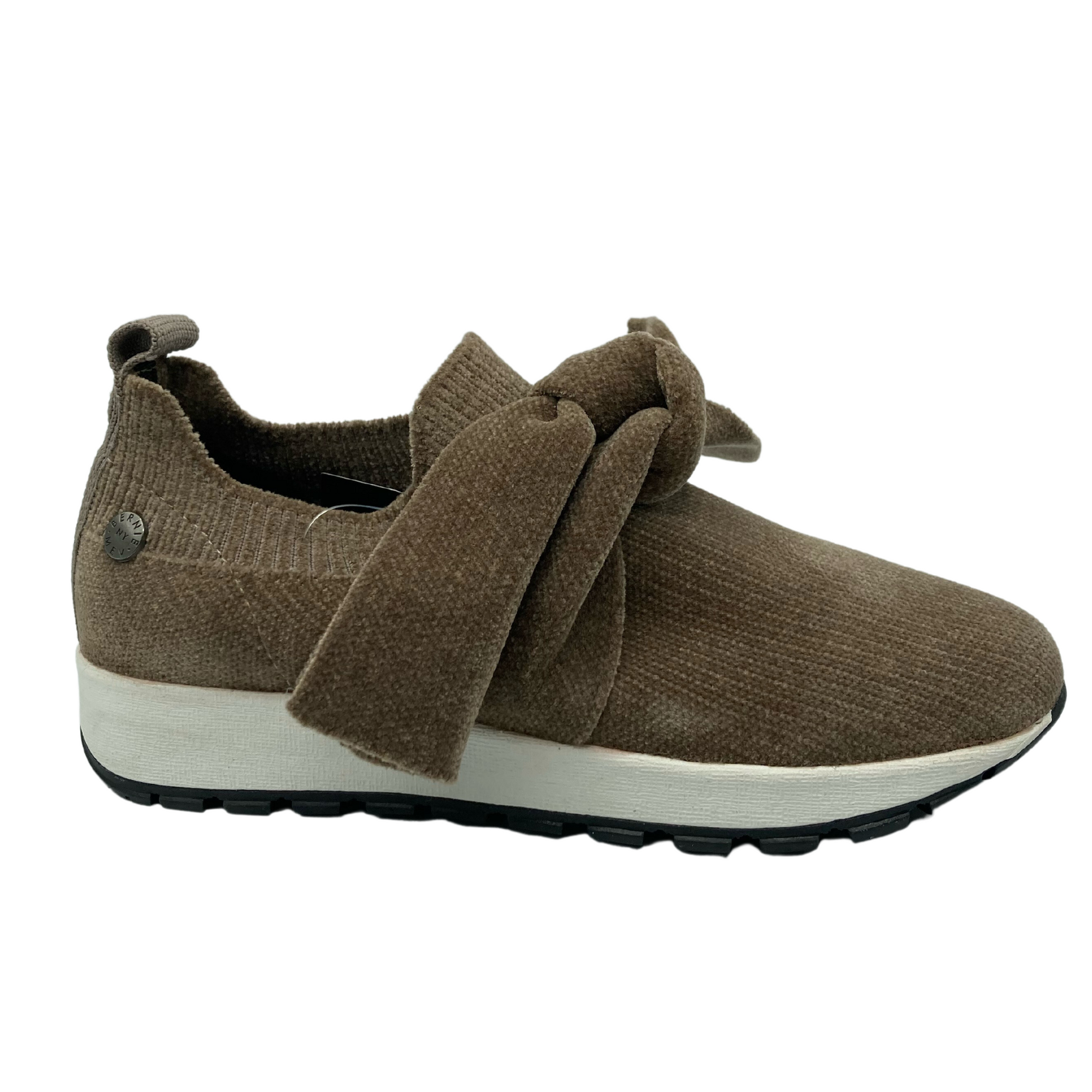 Right facing view of slip on brown sneaker with bow detail on upper and thick rubber outsole