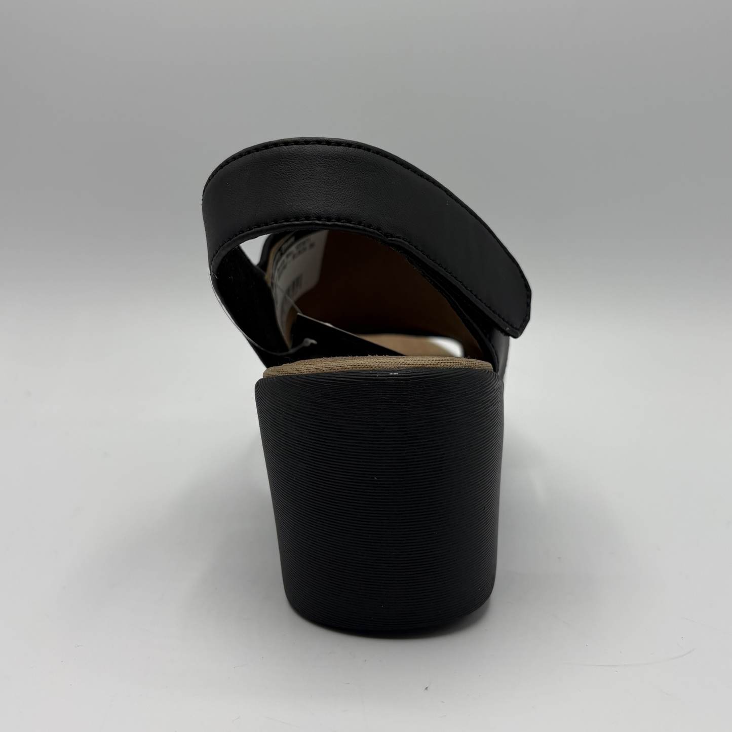Black sandal on a light gray background