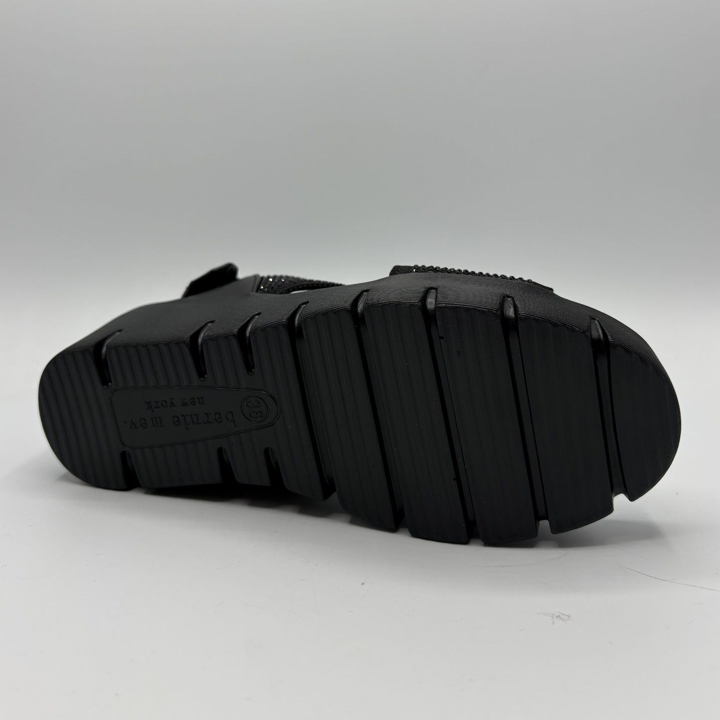 Black sandal sole on a gray background