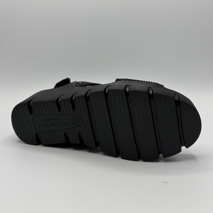 Black sandal sole on a gray background
