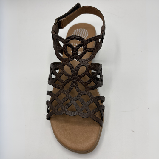 Brown sandal with woven straps on a white background