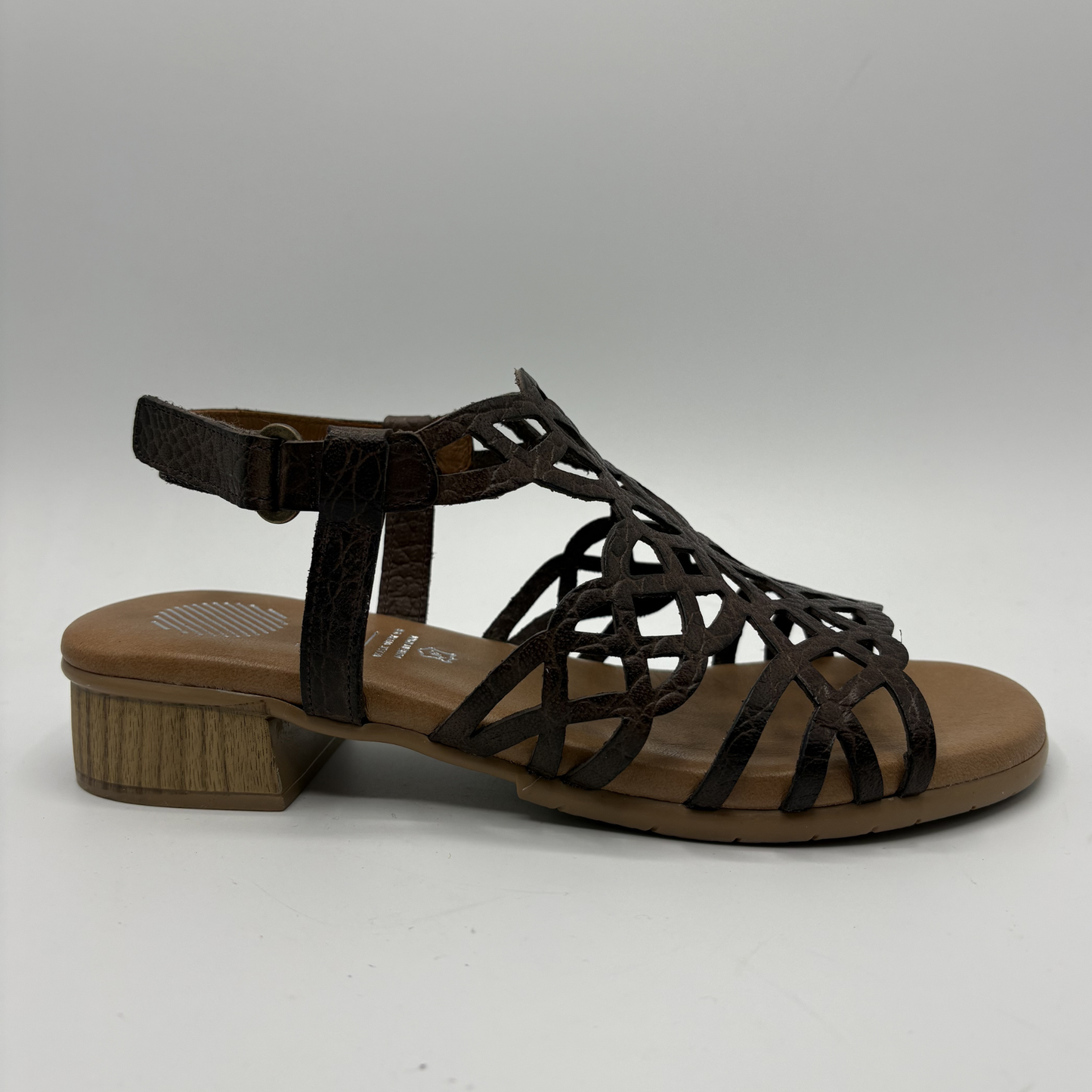 Brown sandal with a wooden sole on a white background