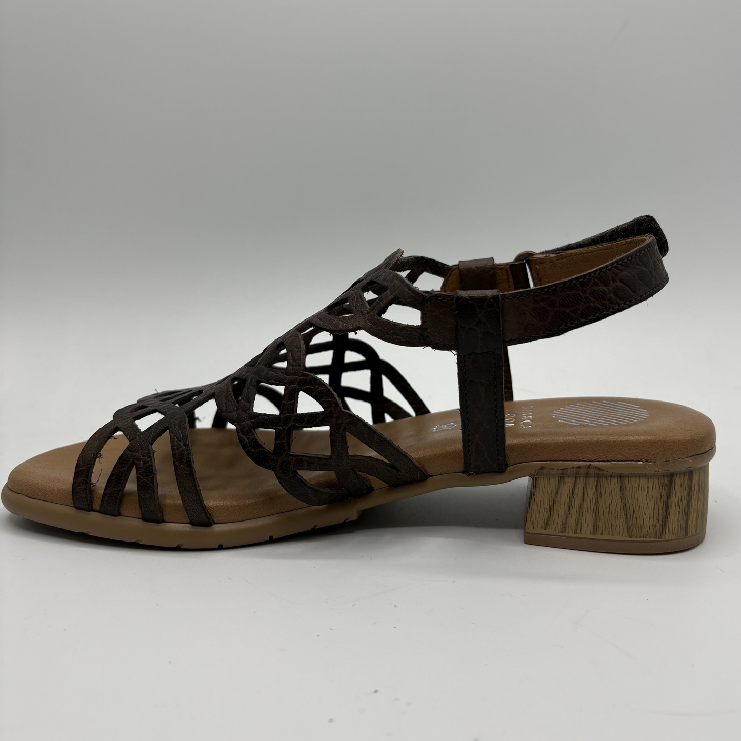 Brown sandal with wooden sole on a white background