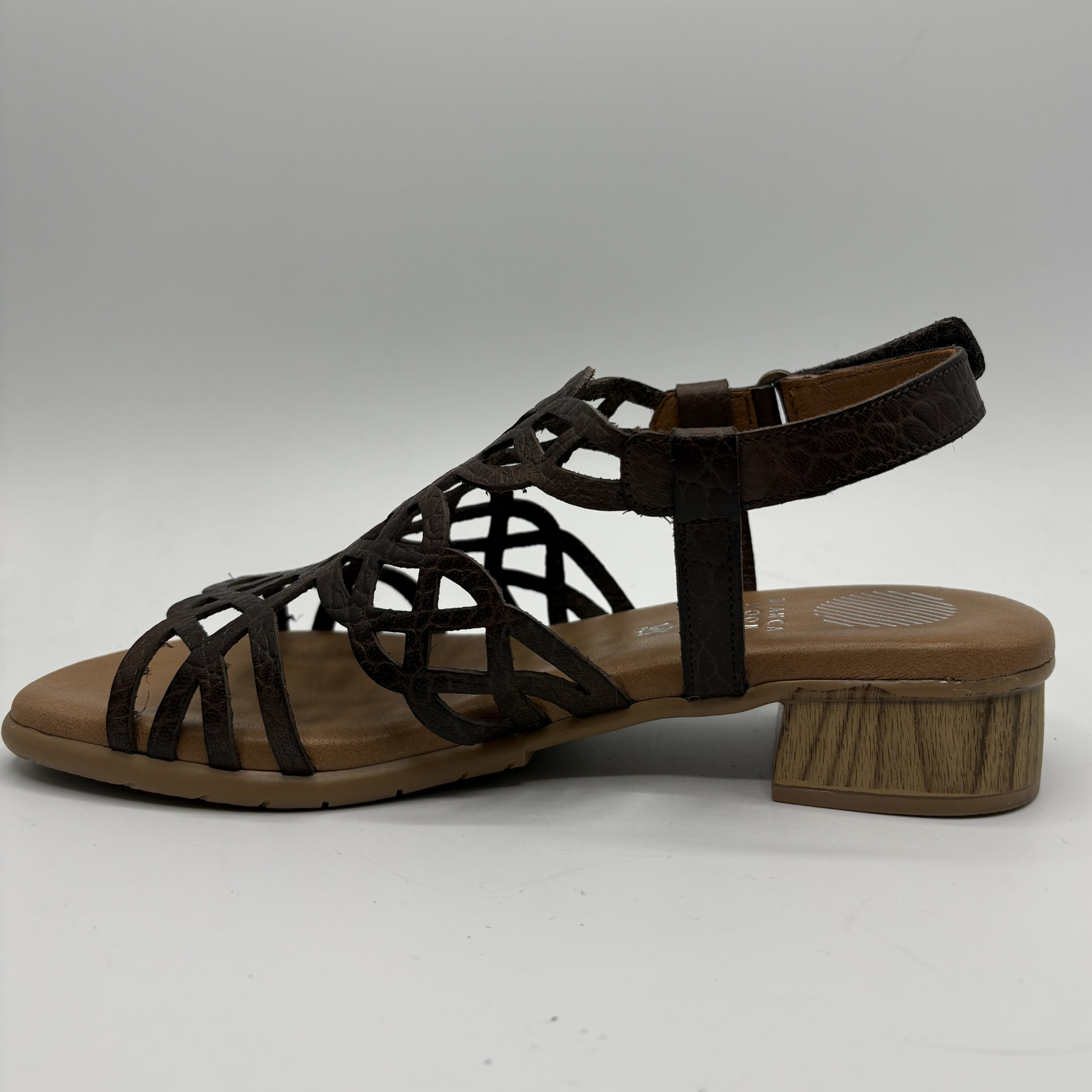 Brown sandal with wooden sole on a white background