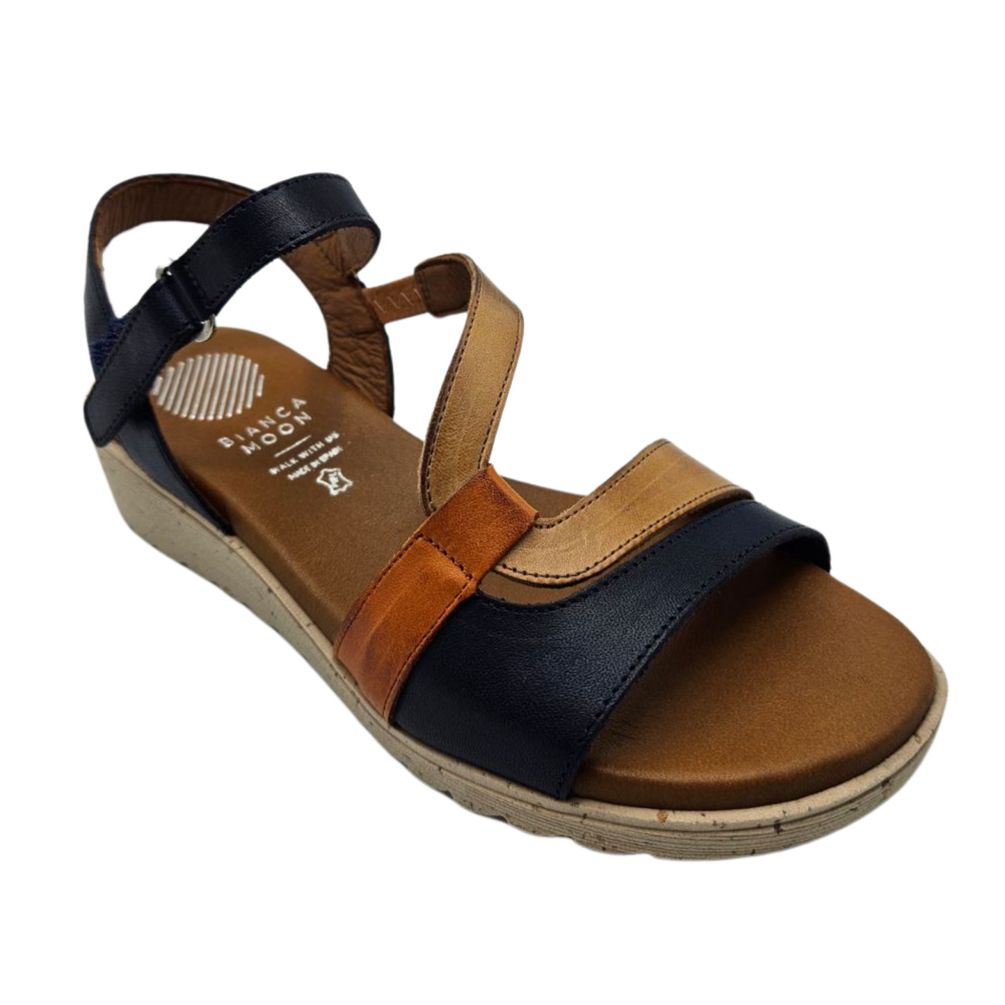 45 degree angled view of leather wedge sandal with open toe and multicoloured straps.