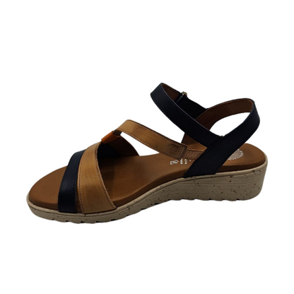 Left facing view of leather wedge sandal with open toe and multicoloured straps.