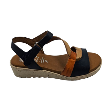 Right facing view of leather wedge sandal with open toe and multicoloured straps.