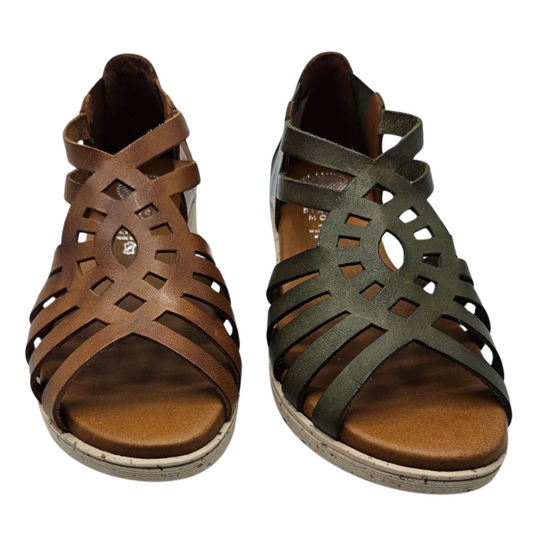 Front view of two leather sandals beside each other. One is tan and one is olive green. Both have an intricate cut out design, peep toe and leather insoles