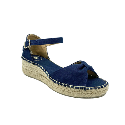 Anlged front view of an espadrille sandal.  Shown in navy blue.  Open toe and closed heel with ankle strap