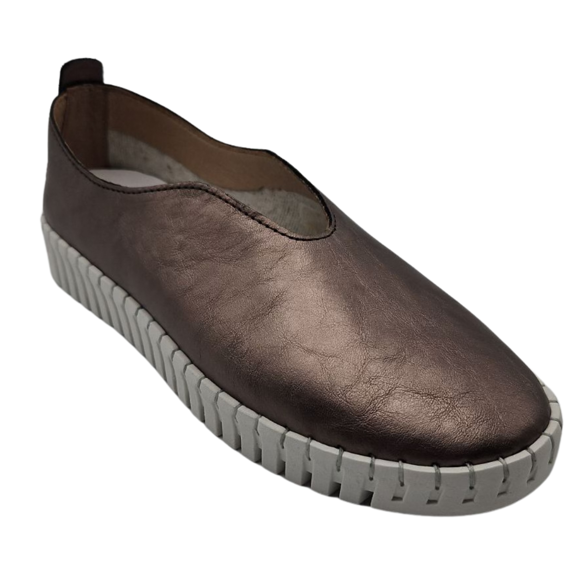 45 degree angled view of pewter leather slip on shoe with white rubber outsole