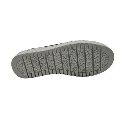 Bottom view of pewter leather slip on shoe with white rubber outsole