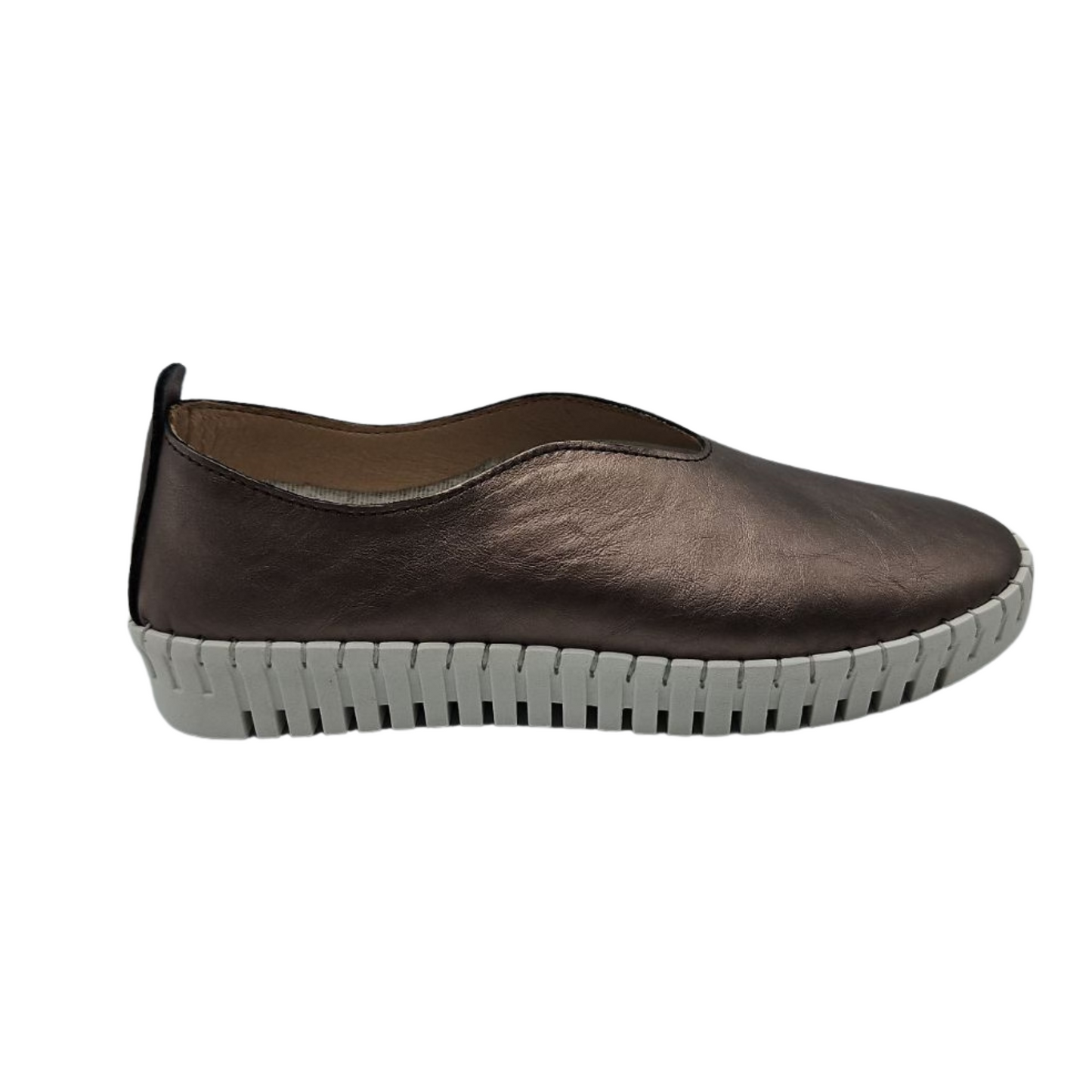 Right facing view of pewter leather slip on shoe with white rubber outsole