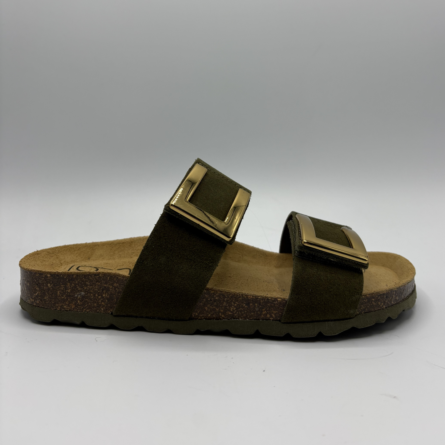 Brown sandal with gold buckles on a gray background