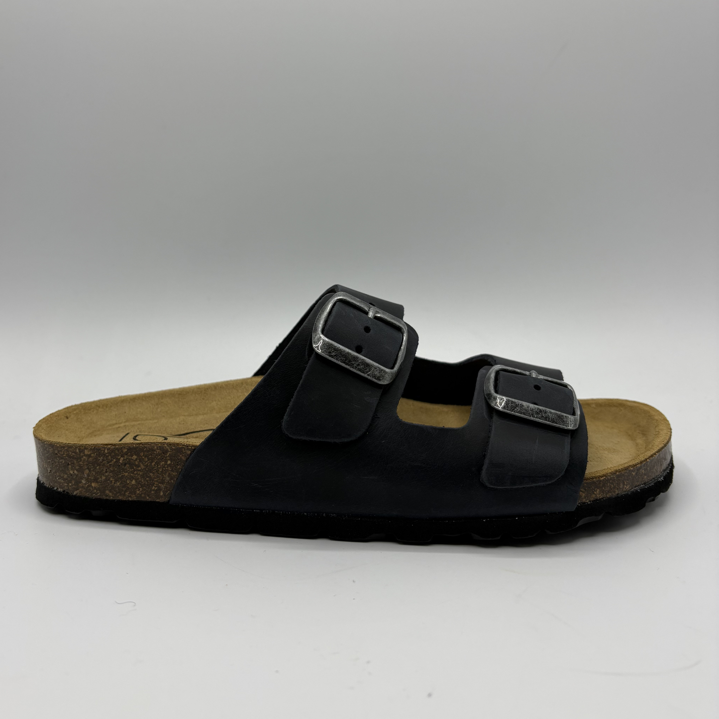 Black sandal with cork sole on a white background