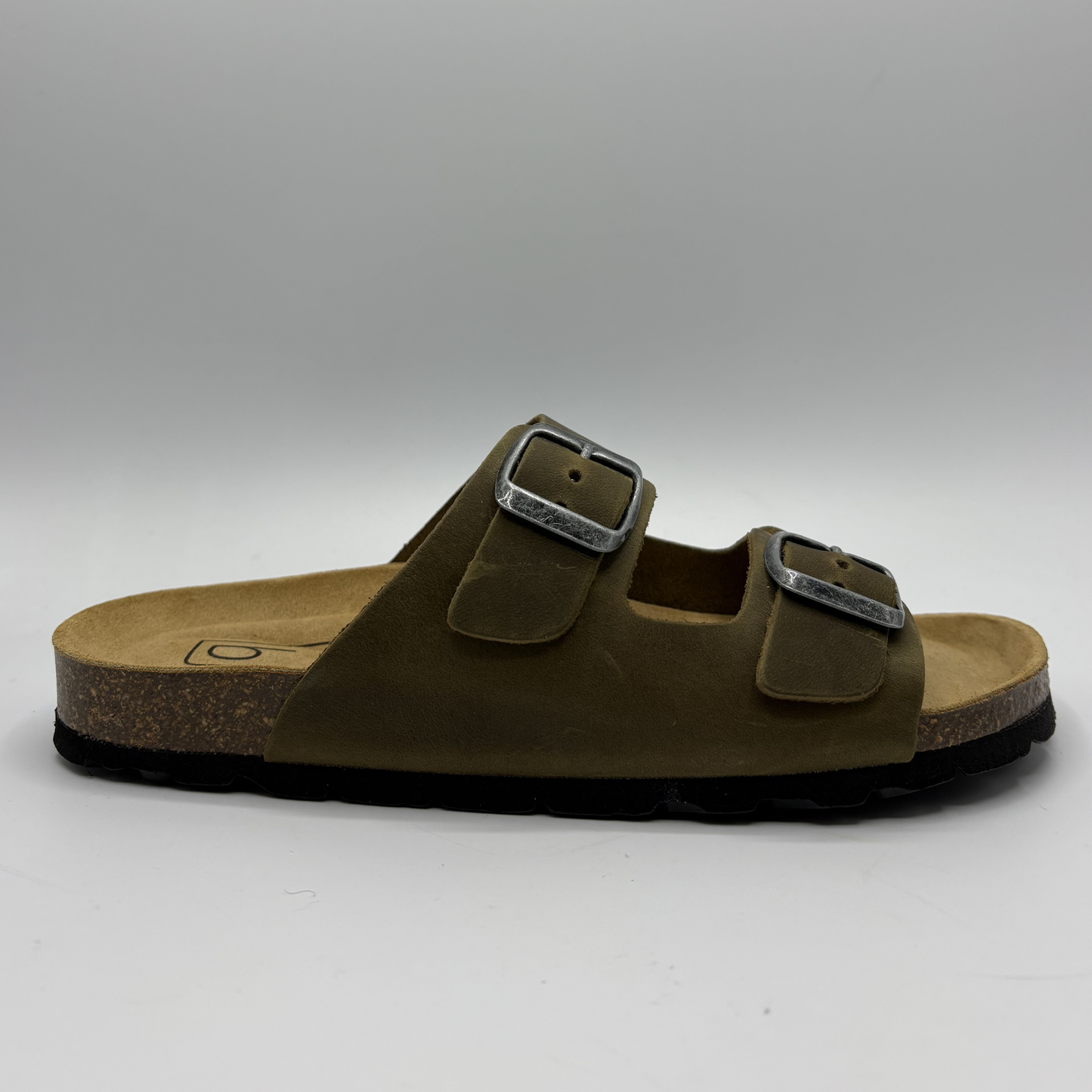 Brown sandal with double buckle on a gray background