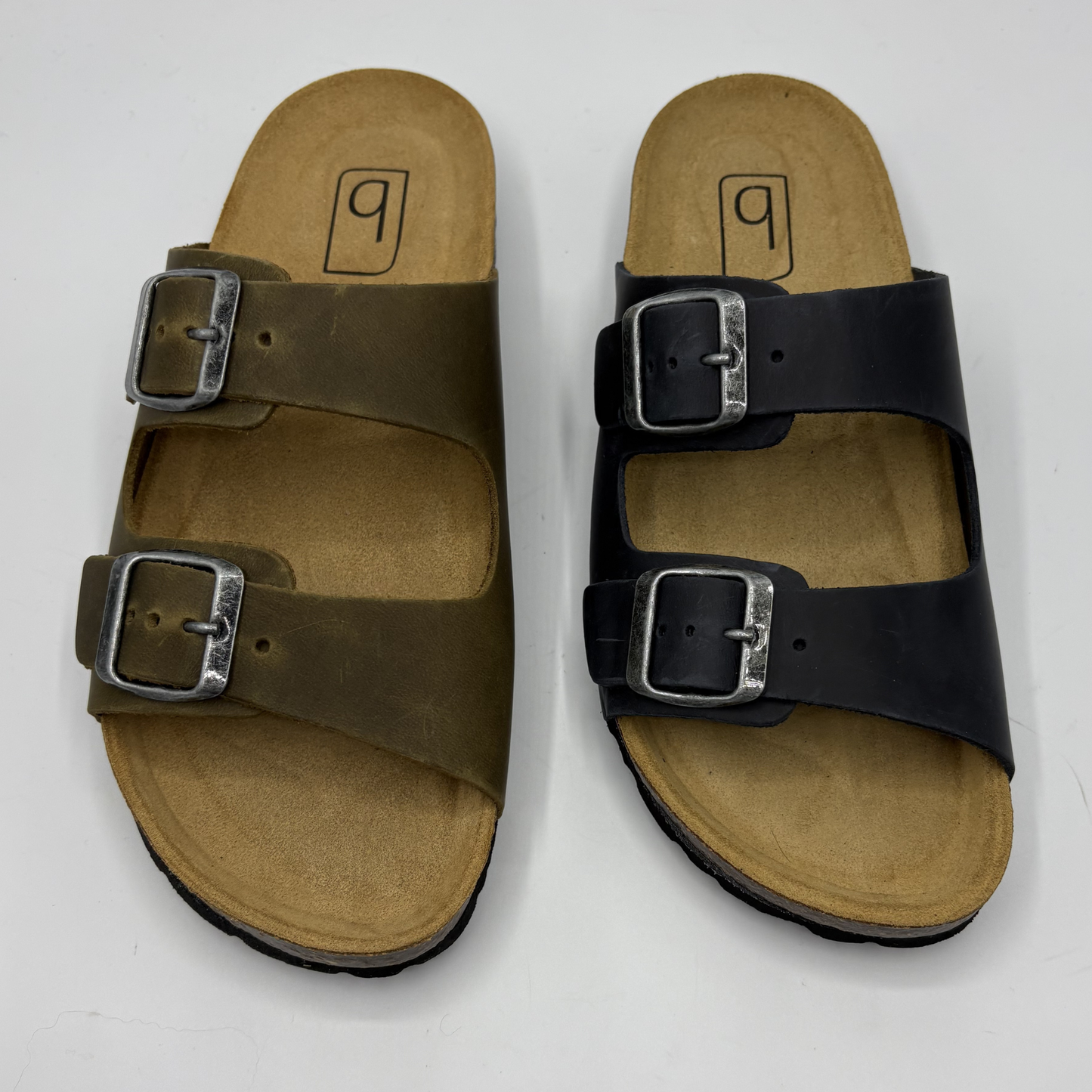 Pair of sandals with buckles on a white background