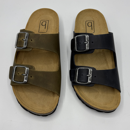 Pair of sandals with buckles on a white background