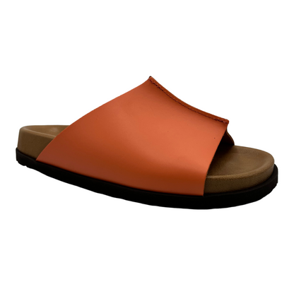 45 degree angled view of peach leather slide on sandal with lined contoured footbed