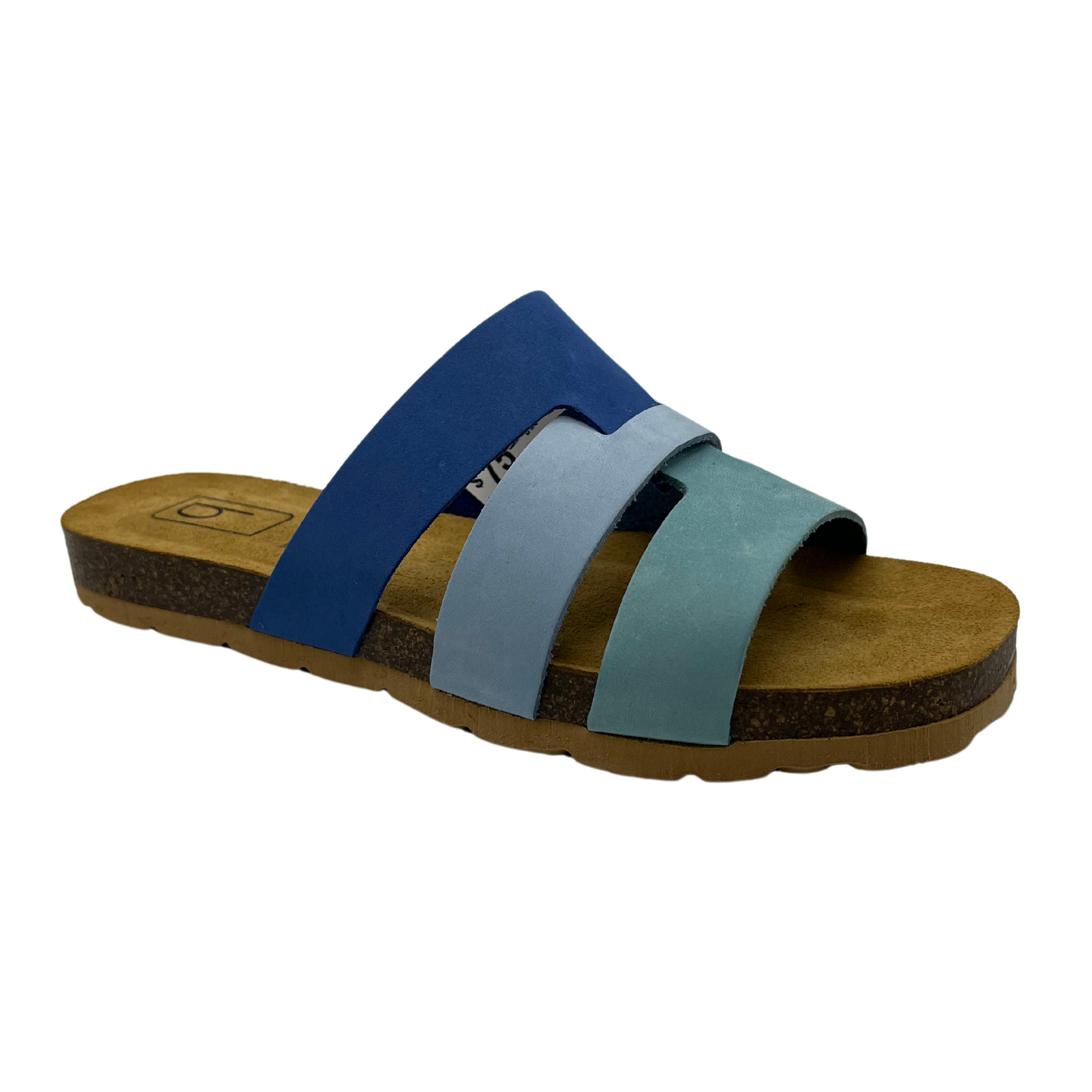 45 degree angled view of blue suede slip on sandal with suede lined contoured footbed