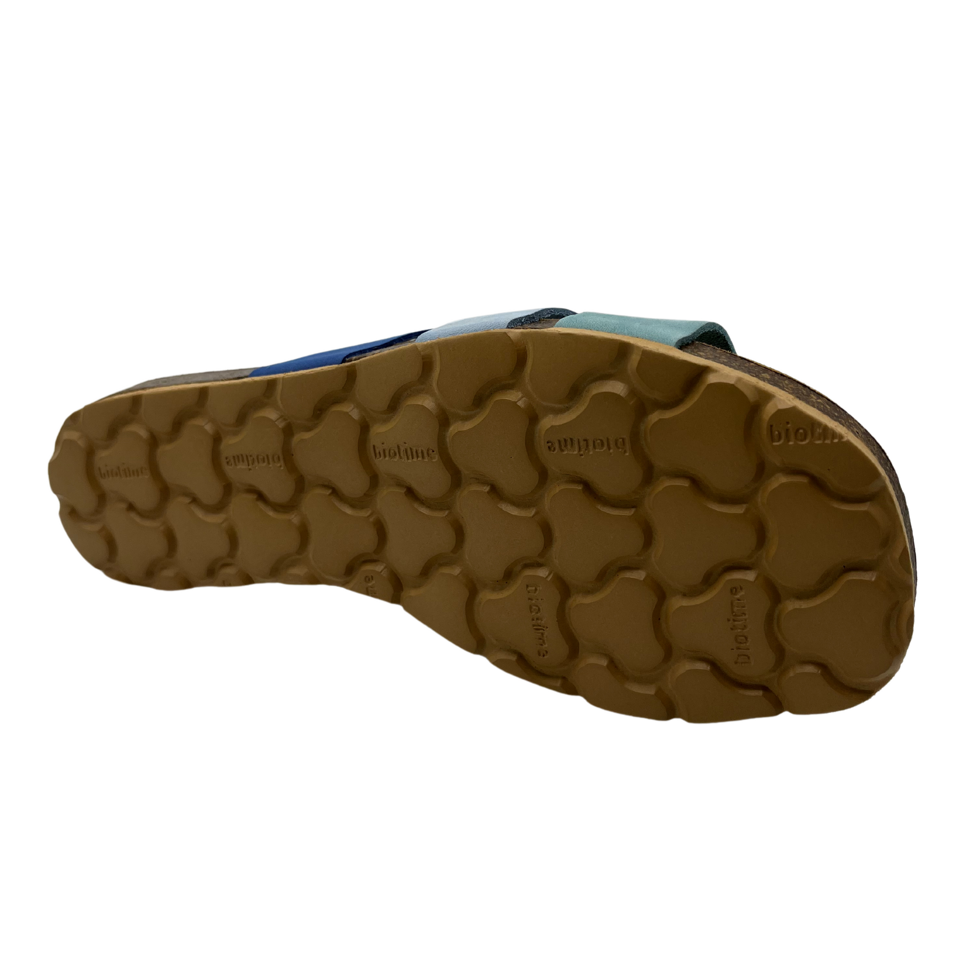Bottom view of blue suede slip on sandal with suede lined contoured footbed