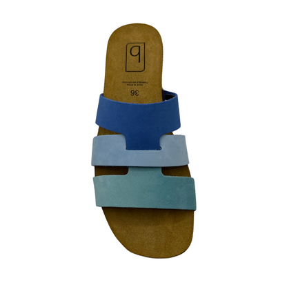 Top view of blue suede slip on sandal with suede lined contoured footbed