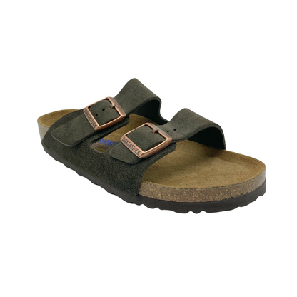 45 degree angled view of grey and brown suede sandal with brass buckles on the straps