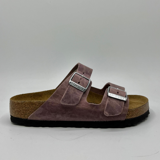 Right facing view of a lavender oiled leather sandal with a contoured cork footbed and two adjustable straps.