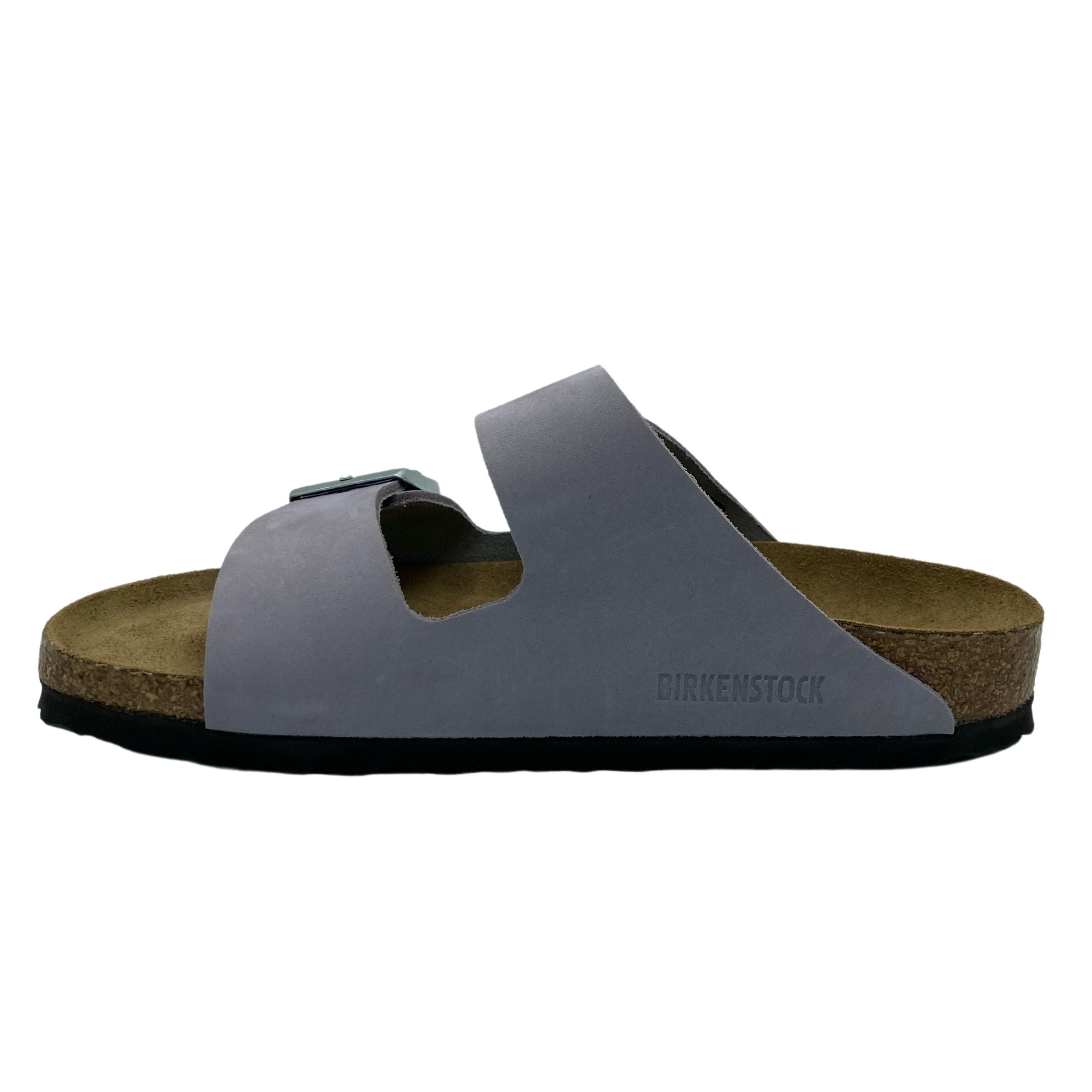 Left facing view of leather suede sandal with light purple upper and two toned brown footbed
