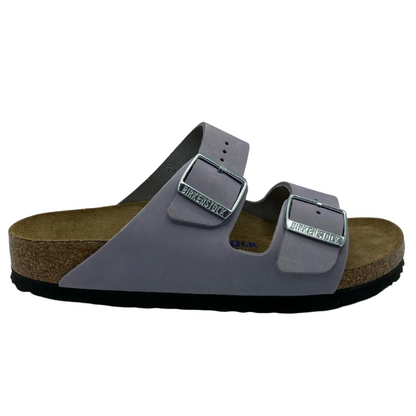 Right facing view of light purple suede sandal with two silver buckles on straps
