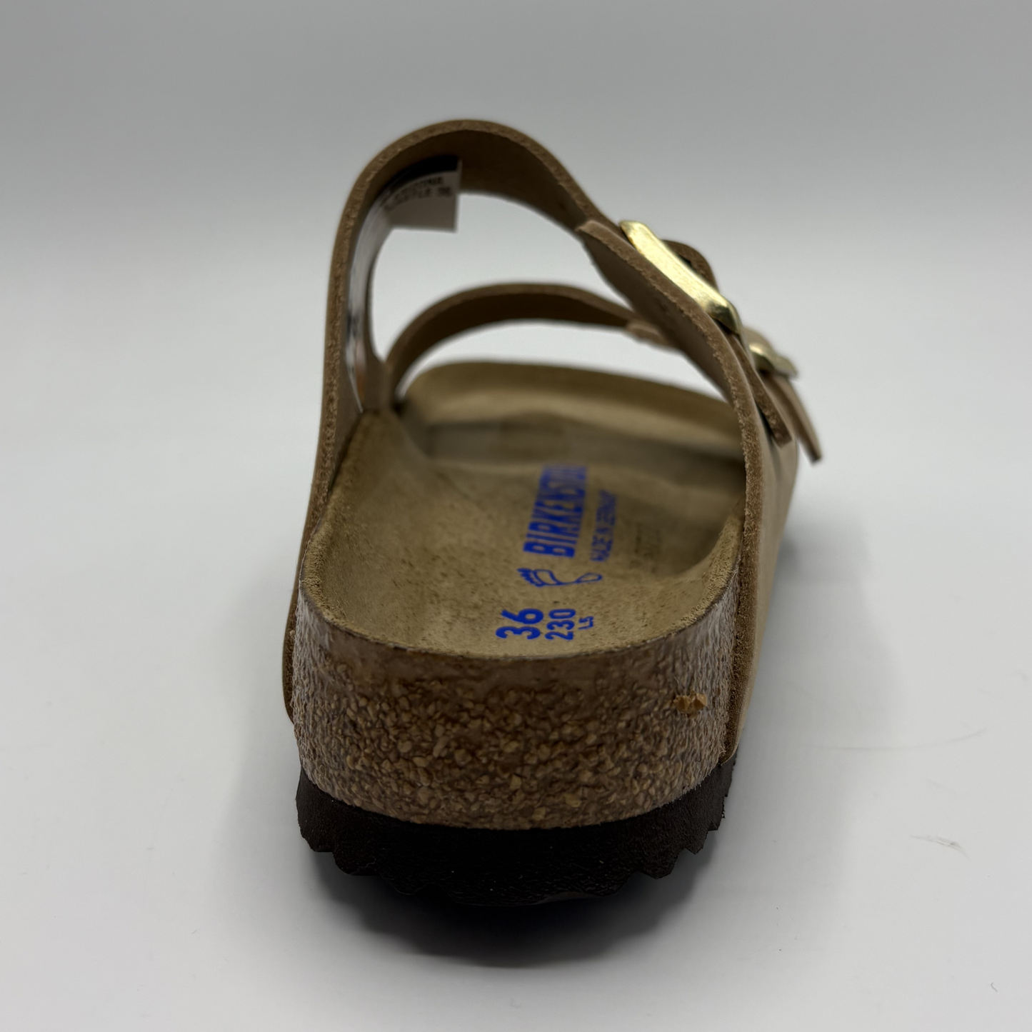 Brown sandal with cork sole on a white background