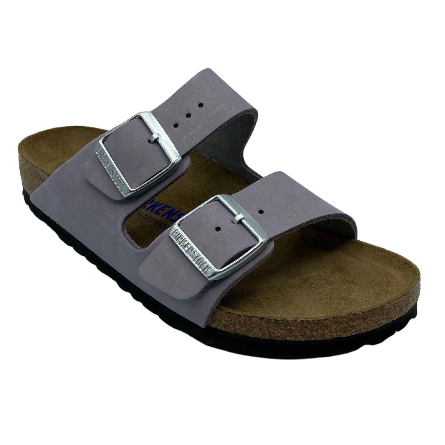 45 degree angled view of  light purple suede sandal with silver buckles on the straps and brown footbed