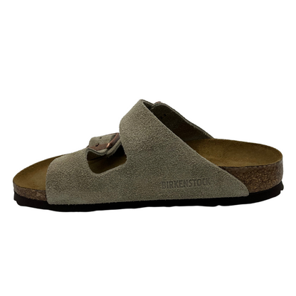 Left facing view of contoured footbed sandal with taupe straps and silver buckles