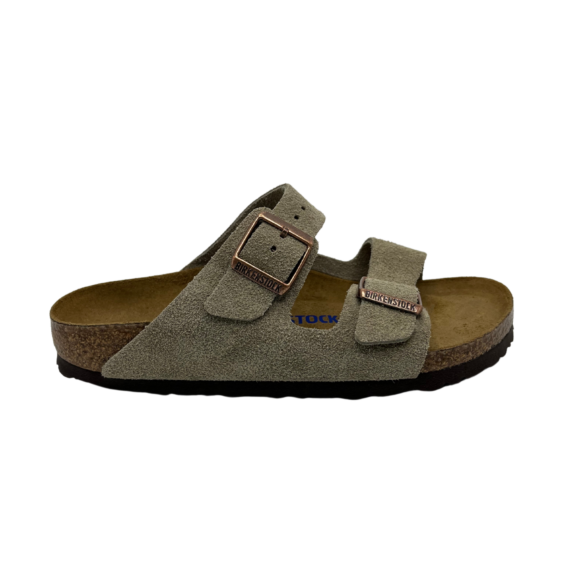 Right facing view of contoured footbed sandal with taupe straps and silver buckles